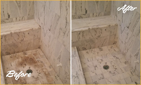 Before and After Picture of a Dirty Massapequa Marble Shower Cleaned to Eliminate Dark Stains