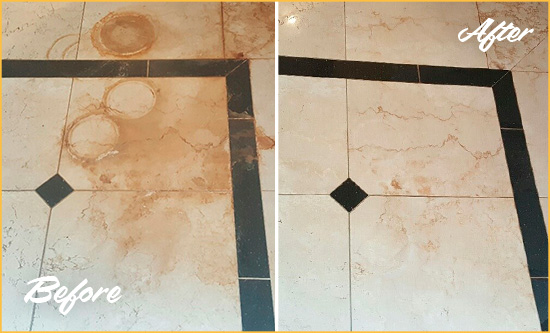 Before and After Picture of a Saddle Rock Hard Surface Restoration Service on a Marble Floor to Eliminate Rust Stains